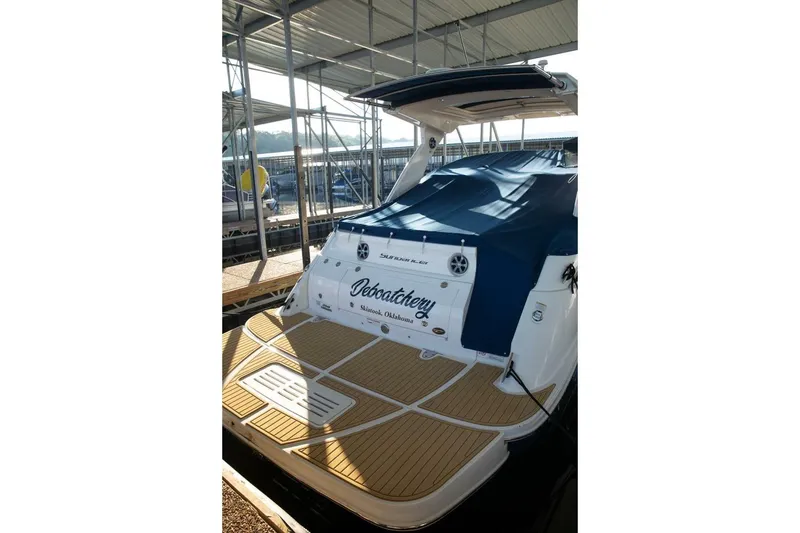 Slide: The Image of 2016 Sea Ray 350 Sundancer boat side view with blue and white hull. - 21