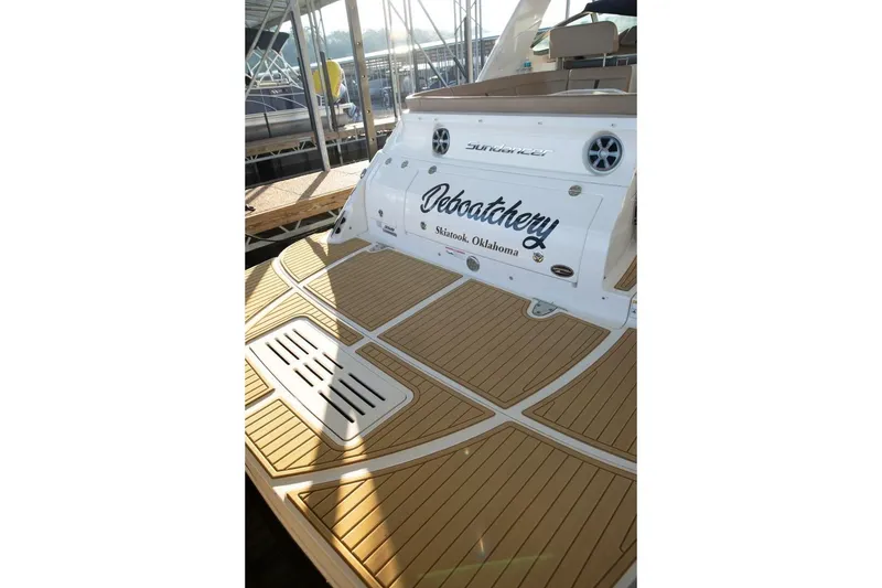 Slide: The Image of 2016 Sea Ray 350 Sundancer boat with teak deck, docked in a marina. - 25