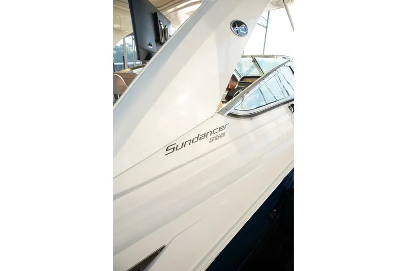 Slide: The Image of 2016 Sea Ray 350 Sundancer cruising on calm waters under clear skies. - 3