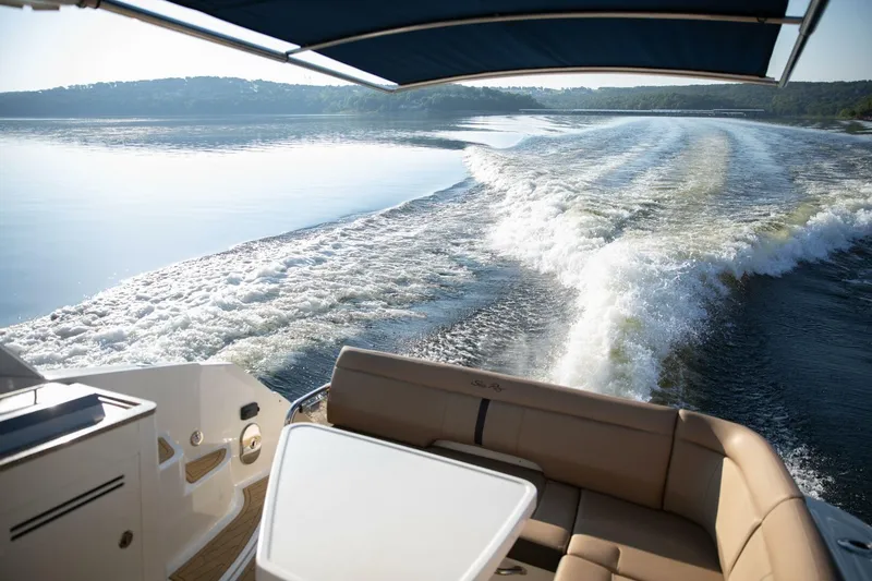 Slide: The Image of Wake behind a 2016 Sea Ray 350 Sundancer on a serene lake. - 31