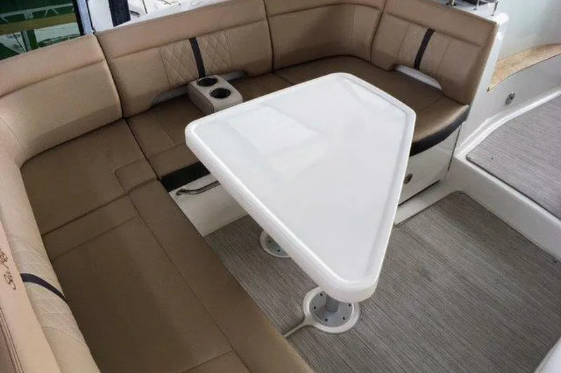 Slide: The Image of Luxurious seating area on a 2016 Sea Ray 350 Sundancer yacht with a triangular table. - 44