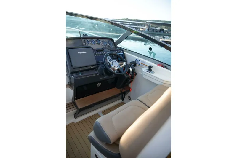 Slide: The Image of 2016 Sea Ray 350 Sundancer boat with sun deck on calm water. - 5
