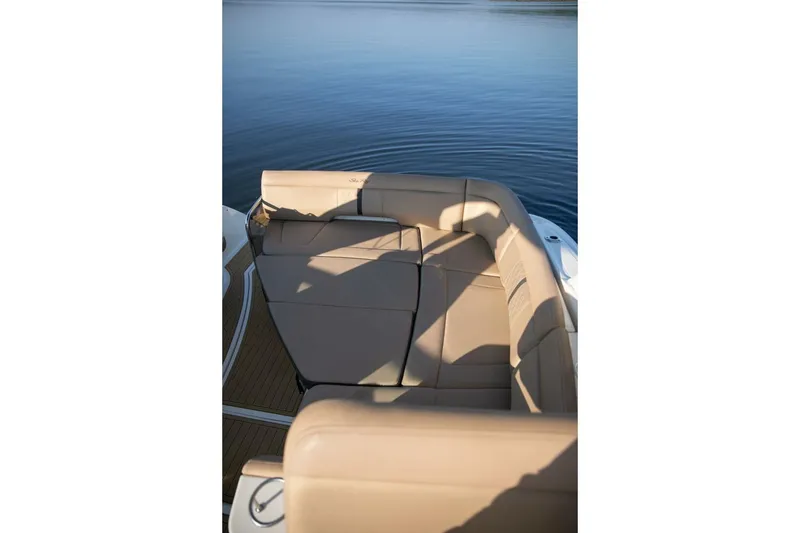 Slide: The Image of Interior view of 2016 Sea Ray 350 Sundancer yacht with luxurious seating and helm. - 53