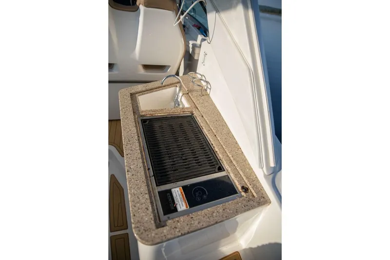 Slide: The Image of 2016 Sea Ray 350 Sundancer boat with built-in Dometic refrigerator. - 61