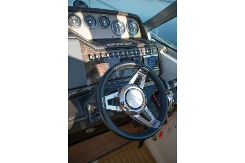 Slide: The Image of Dashboard of 2016 Sea Ray 350 Sundancer boat with gauges and controls. - 67