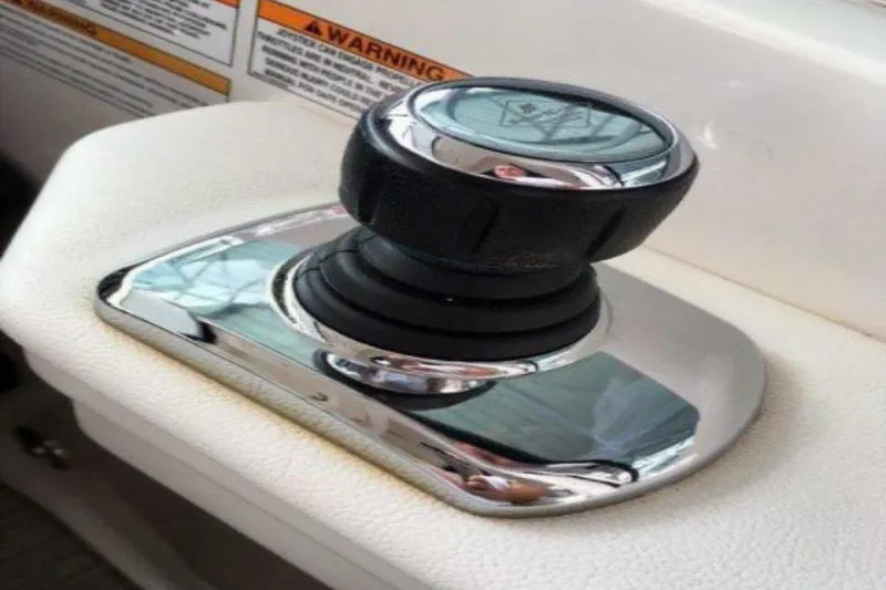 Slide: The Image of Control panel of 2016 Sea Ray 350 Sundancer boat with throttle and safety lanyard. - 70