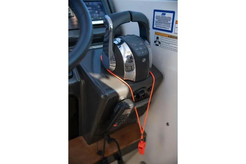 Slide: The Image of Control panel of a 2016 Sea Ray 350 Sundancer boat, featuring throttle and navigation controls. - 71