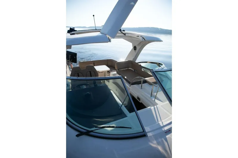 Slide: The Image of Bow view of 2016 Sea Ray 350 Sundancer anchor against dark water. - 78