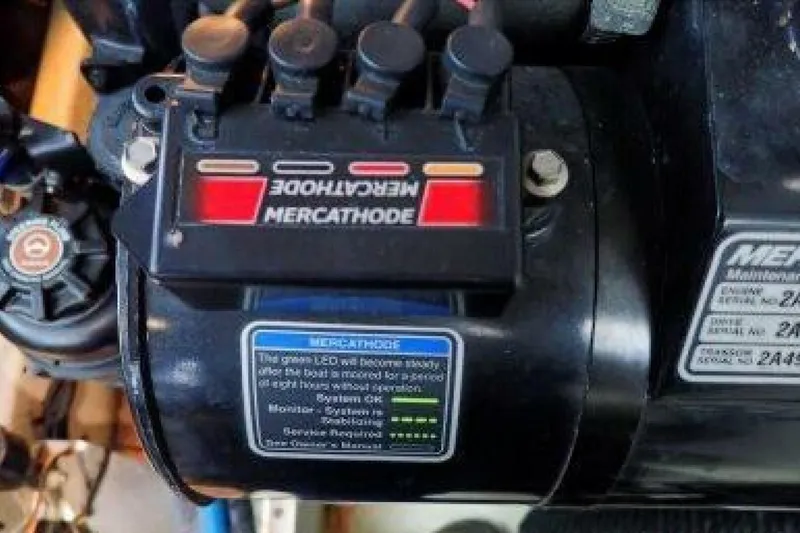 Slide: The Image of Engine compartment of a 2016 Sea Ray 350 Sundancer boat, showcasing mechanical components. - 80