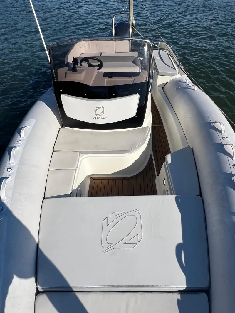 Slide: The Image of 2015 Zodiac N-ZO 760 boat with sleek design and spacious seating on water. - 23
