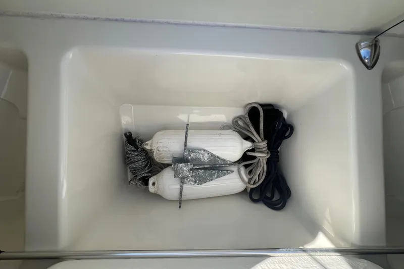 Slide: The Image of Storage compartment with ropes and fenders on a 2015 Zodiac N-ZO 760 boat. - 26