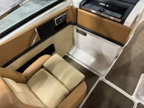 Slide: The Image of 2015 Sea Ray 250 SLX interior with tan leather seating and sleek design. - 10