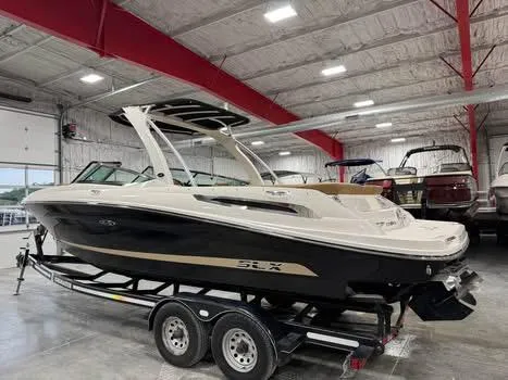 Slide: The Image of 2015 Sea Ray 250 SLX boat on trailer in indoor showroom. - 4
