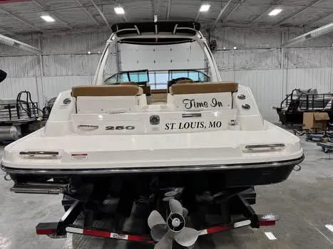 Slide: The Image of 2015 Sea Ray 250 SLX boat named "Time In" in a warehouse setting. - 5