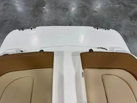 Slide: The Image of 2015 Sea Ray 250 SLX boat interior with tan seating and white deck. - 7