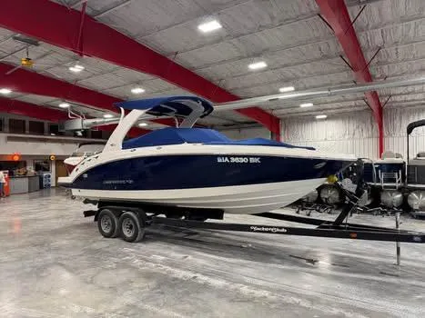 Slide: The Image of 2011 Chaparral 264 Sunesta boat on trailer in indoor storage facility. - 14