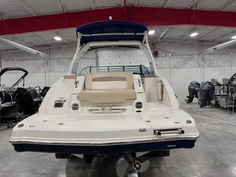 Slide: The Image of 2011 Chaparral 264 Sunesta boat in a showroom, rear view. - 5