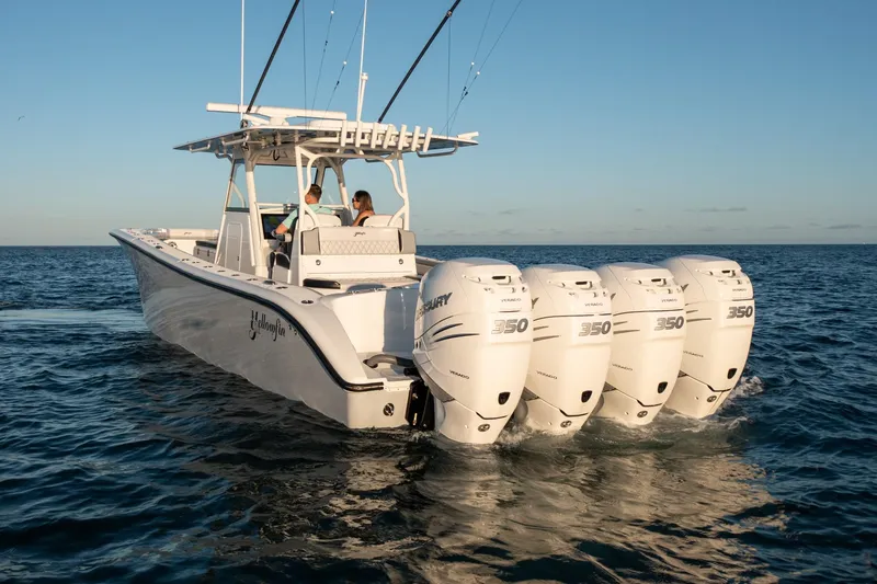Slide: The Image of 2019 Yellowfin 39 boat with four Mercury 350 outboard engines on open water. - 14