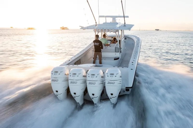 Slide: The Image of 2019 Yellowfin 39 boat with quad outboard engines cruising on the water. - 15