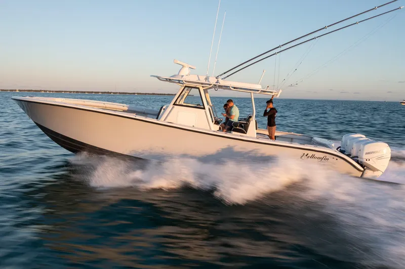 Slide: The Image of 2019 Yellowfin 39 boat cruising on the water at sunset. - 3