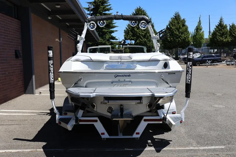 Slide: The Image of Rear view of a 2018 MB B52 23 boat parked outdoors. - 11