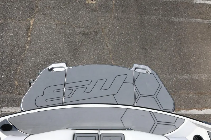 Slide: The Image of Top view of 2018 MB B52 23 boat platform with logo and hexagonal pattern. - 16