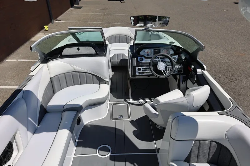 Slide: The Image of Interior of a 2018 MB B52 23 boat with modern seating and dashboard. - 20