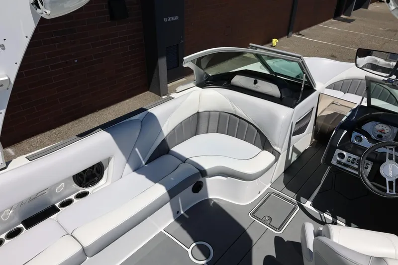 Slide: The Image of Interior of 2018 MB B52 23 boat with sleek seating and modern dashboard. - 22