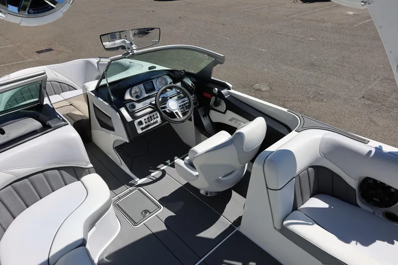 Slide: The Image of Luxurious interior of 2018 MB B52 23 boat with sleek white seating and modern dashboard. - 23
