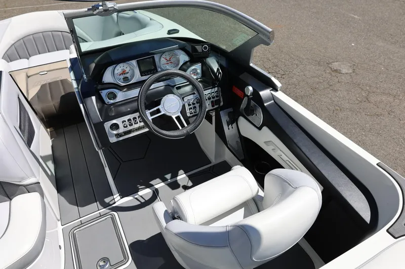 Slide: The Image of Interior of 2018 MB B52 23 boat with modern dashboard and steering wheel. - 25