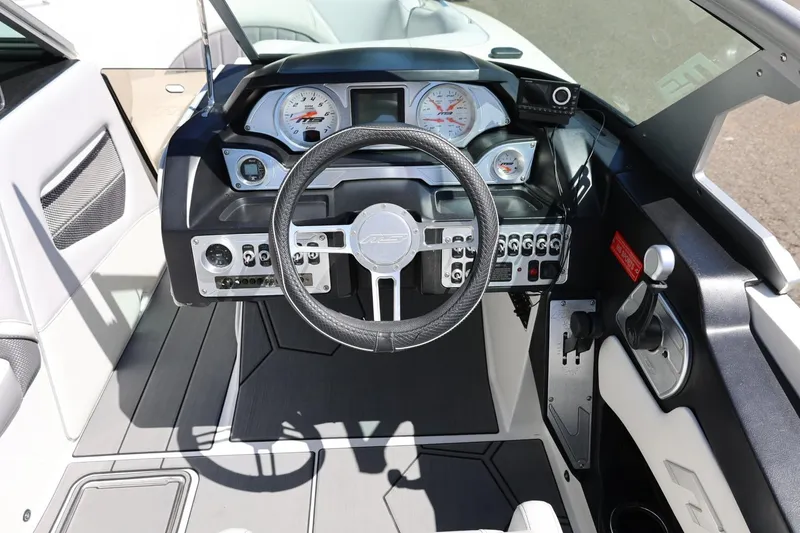 Slide: The Image of Cockpit of 2018 MB B52 23 boat with steering wheel and control panel. - 26