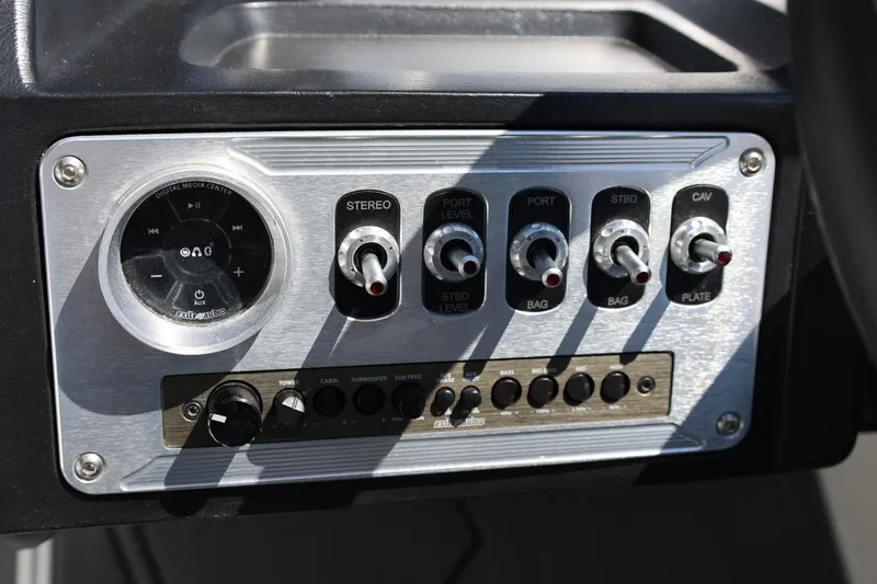 Slide: The Image of Control panel of MB B52 23 boat, featuring stereo and audio controls, 2018 model. - 28