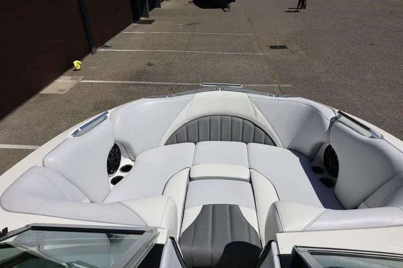 Slide: The Image of Bow seating area of 2018 MB B52 23 boat with white and gray upholstery. - 34