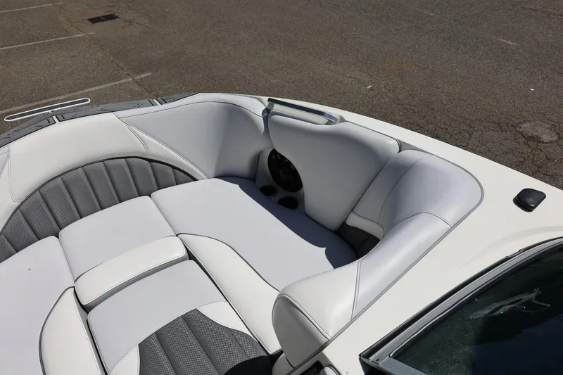 Slide: The Image of Luxurious white and gray seating in a 2018 MB B52 23 boat, parked on asphalt. - 37