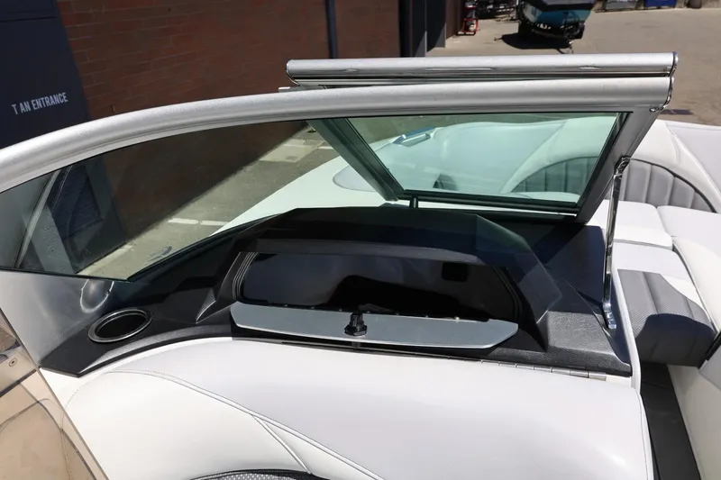 Slide: The Image of 2018 MB B52 23 boat interior with open windshield and seating area. - 38