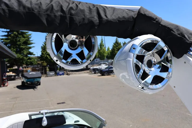 Slide: The Image of Speakers on MB B52 23 boat, 2018 model, in a sunny outdoor setting. - 39