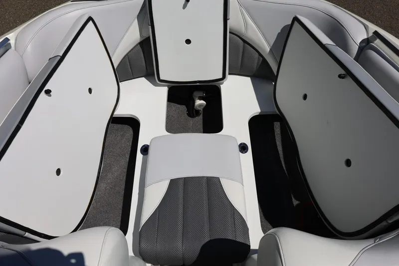 Slide: The Image of 2018 MB B52 23 boat interior with open storage compartments and seating. - 42