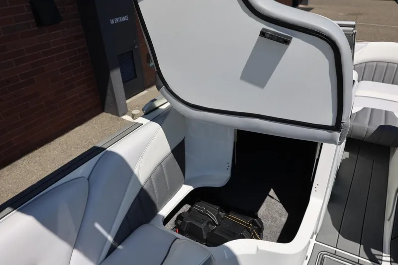 Slide: The Image of 2018 MB B52 23 boat interior storage compartment with open hatch. - 45