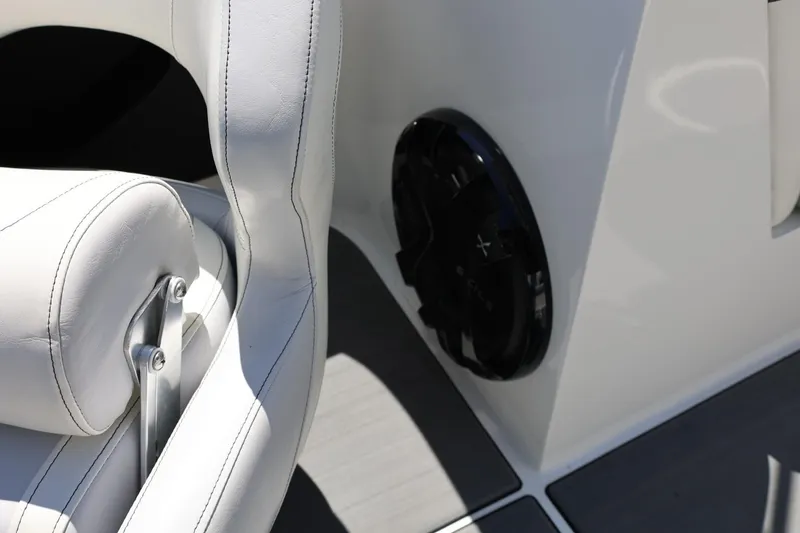 Slide: The Image of White leather seat and speaker in 2018 MB B52 23 boat interior. - 49