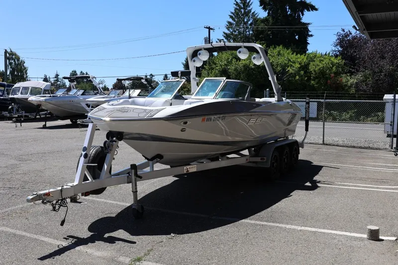 Slide: The Image of 2018 MB B52 23 boat on trailer in parking lot, sunny day. - 7