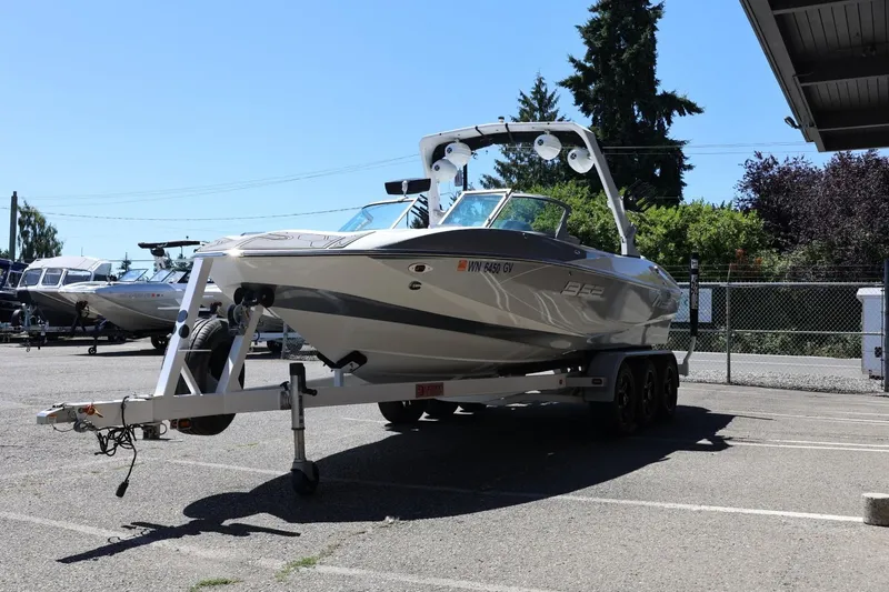 Slide: The Image of 2018 MB B52 23 boat on trailer in parking lot, sunny day. - 8