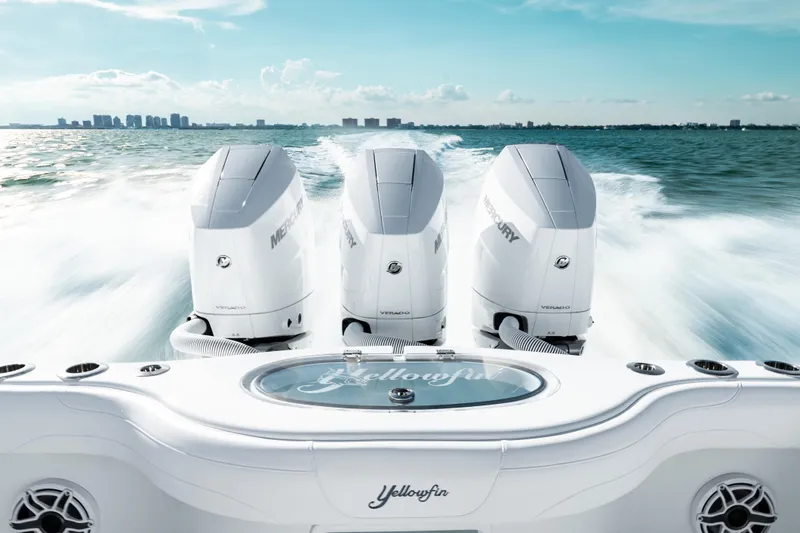 Slide: The Image of 2026 Yellowfin 36 Offshore boat with triple Mercury Verado engines on open water. - 12