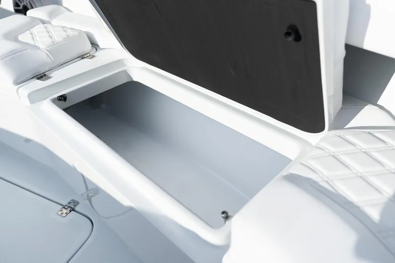 Slide: The Image of 2026 Yellowfin 36 Offshore boat storage compartment with cushioned seating. - 23