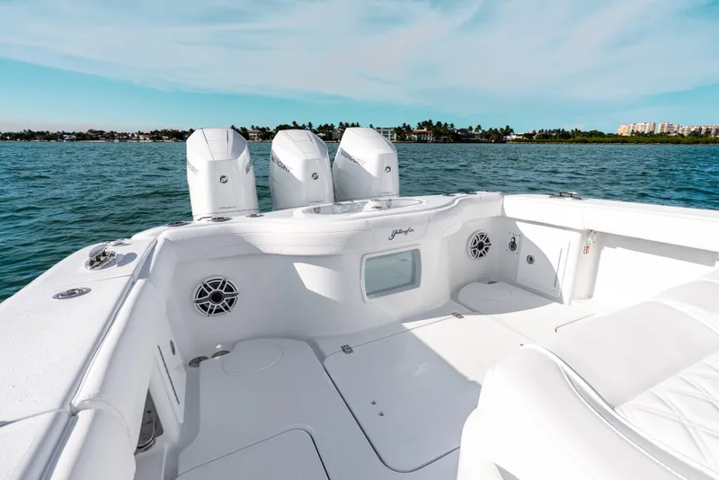 Slide: The Image of 2026 Yellowfin 36 Offshore boat with triple engines on open water. - 25