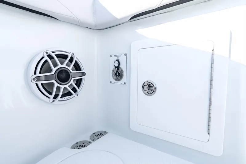 Slide: The Image of 2026 Yellowfin 36 Offshore boat interior with speaker and storage compartment. - 29