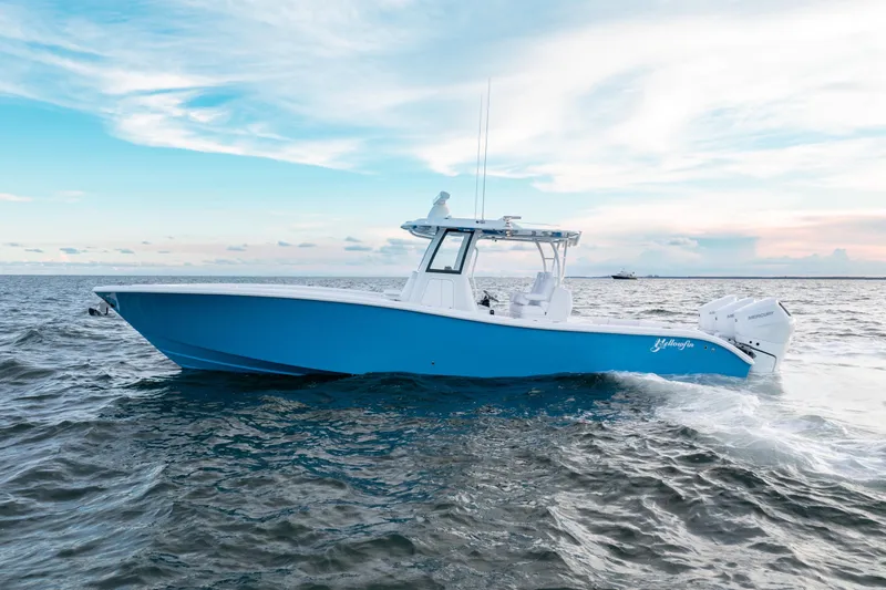 Slide: The Image of 2026 Yellowfin 36 Offshore boat cruising on open water under a clear sky. - 3