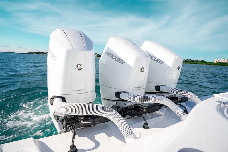 Slide: The Image of 2026 Yellowfin 36 Offshore boat with triple Mercury Verado engines on open water. - 30