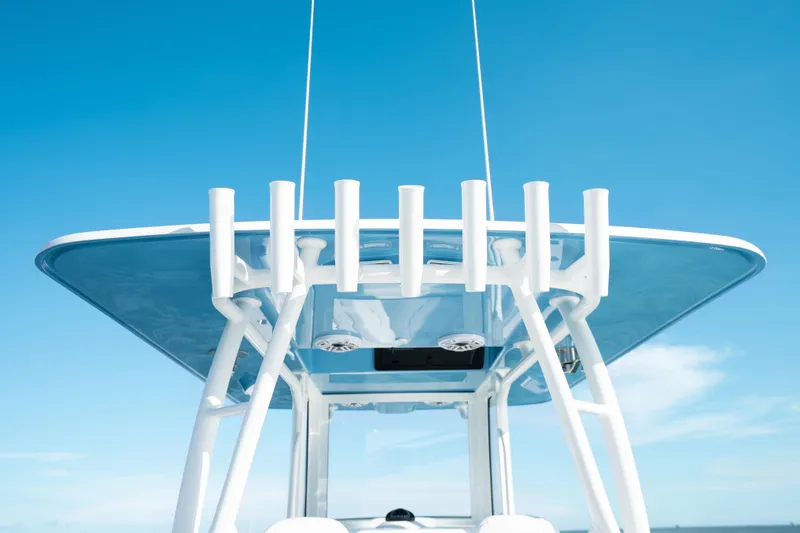 Slide: The Image of 2026 Yellowfin 36 Offshore boat top view against clear blue sky. - 31