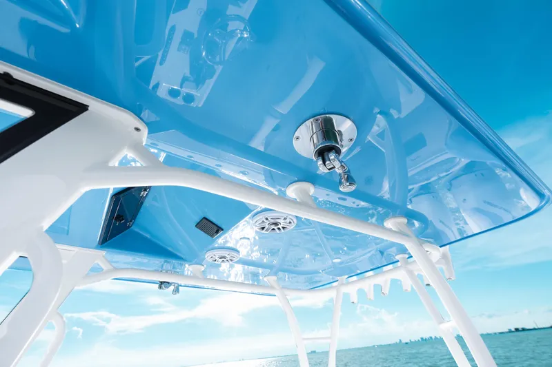 Slide: The Image of 2026 Yellowfin 36 Offshore boat, blue canopy, ocean view, modern design features. - 33