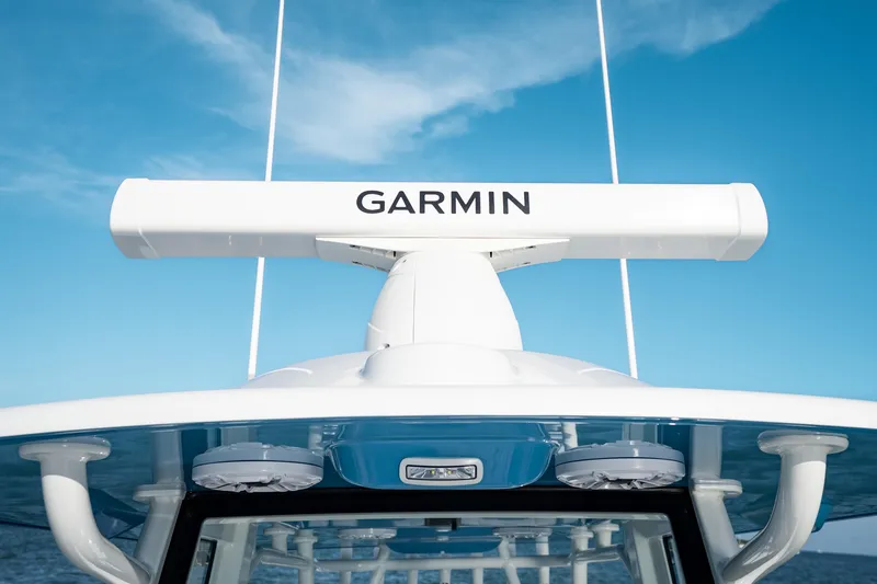 Slide: The Image of 2026 Yellowfin 36 Offshore boat with Garmin radar against blue sky. - 34